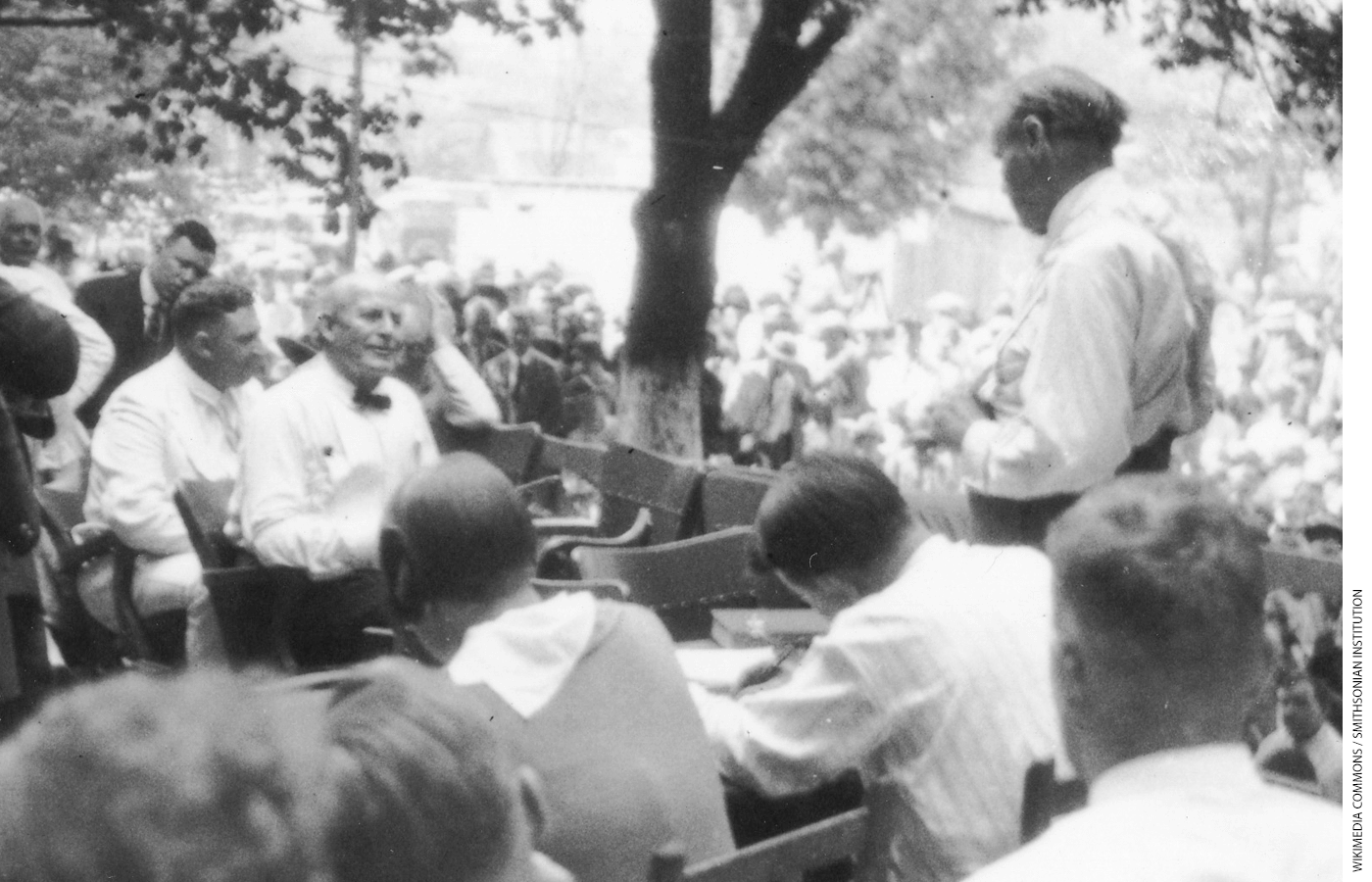 Clarence Darrow questions William Jennings Bryan outdoors during the Scopes Trial.
