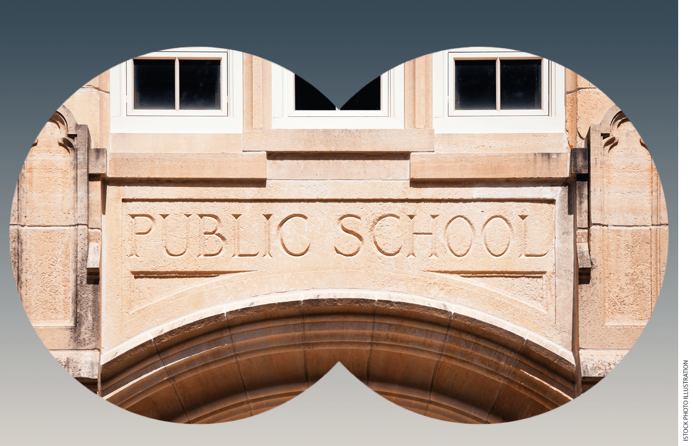The front of a public school building as seen through binoculars