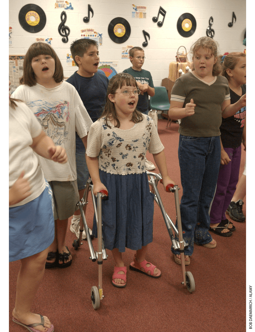 Students singing together in a classroom