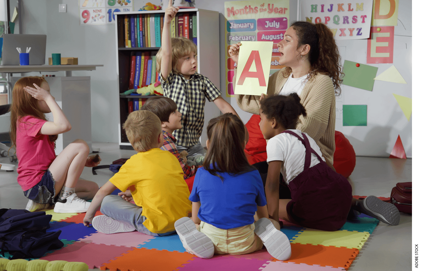 A teacher leads a kindergarten class through a lesson on the alphabet.