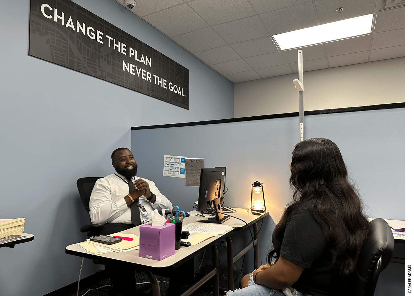 Central Wake’s graduation coach Javon Fluker meets with 10th grader Sulemia Chable-Morales to discuss her short-term goal, which is to get a job as a barista, and long-term goal, which is to go to college for law or business.