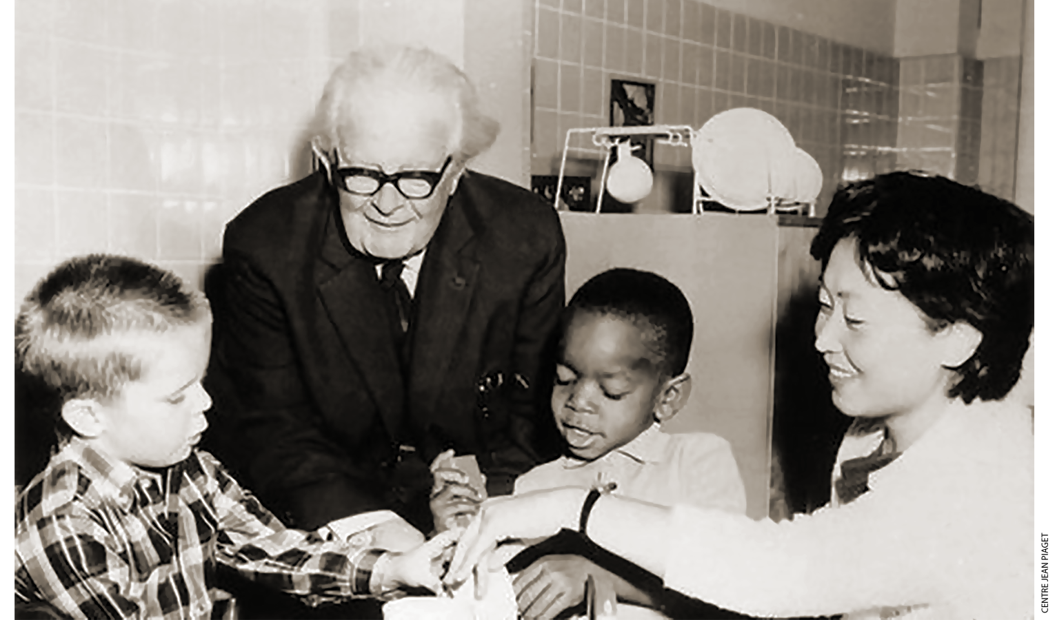 Child psychologists Jean Piaget and Constance Kammi, pictured with two participants