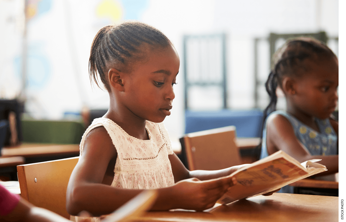 Photo of a student reading in class