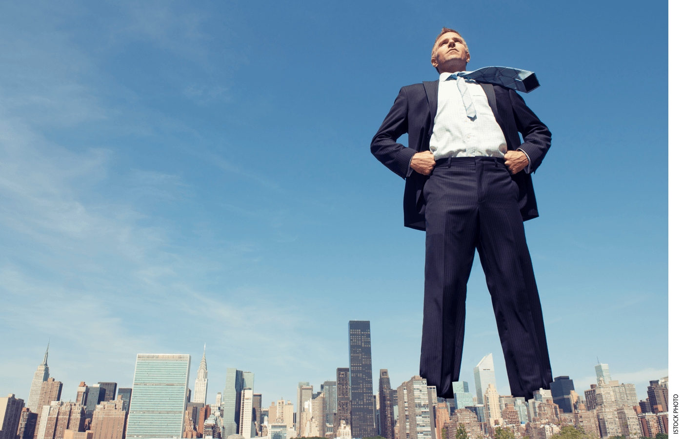 A giant man towers over the New York City skyline