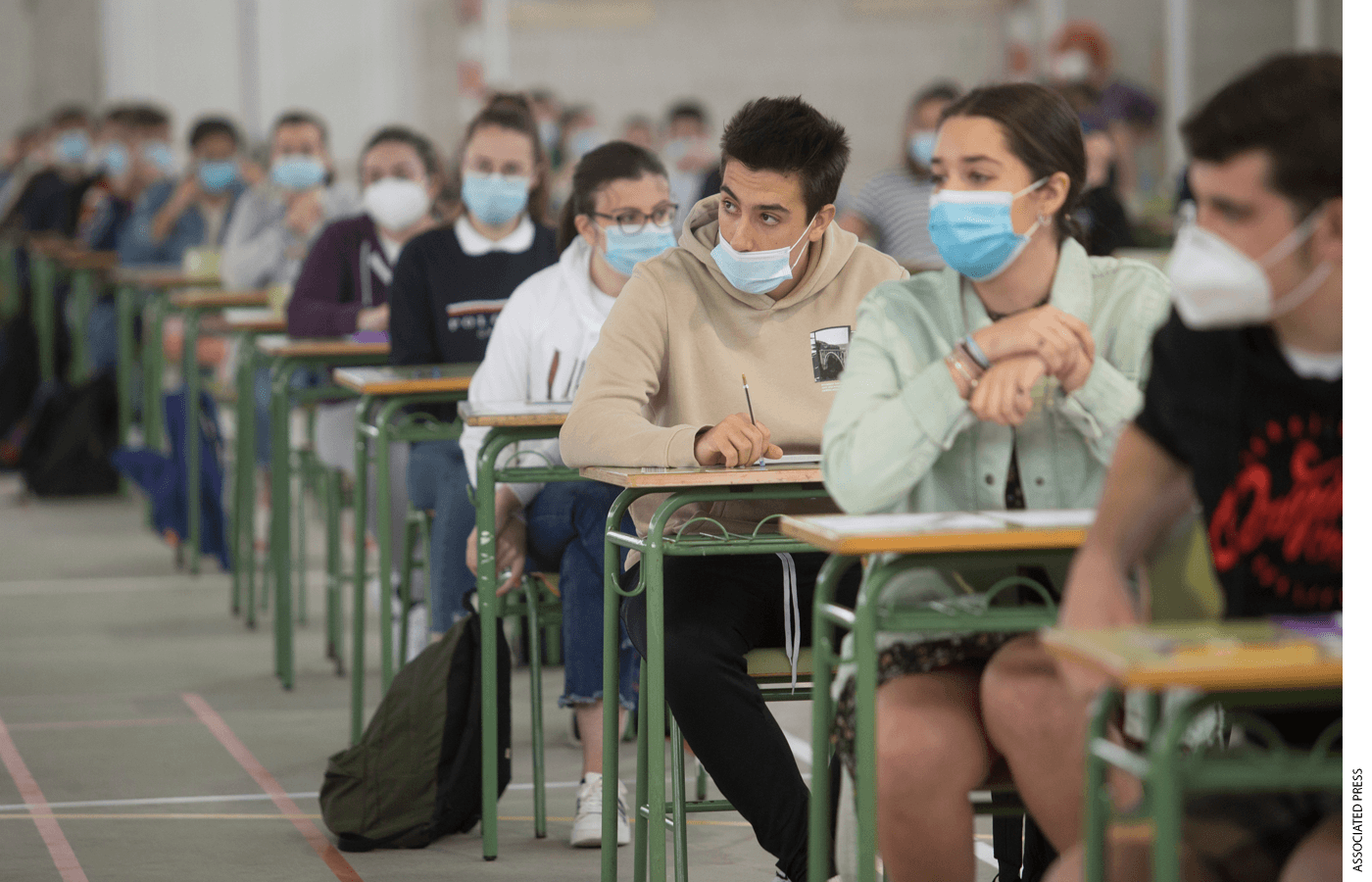 High school students in Viveiro in Galicia, Spain, sit for the Selectivity or University Entrance Examinations on July 7, 2020—an exception granted to a mandated nationwide shutdown to mitigate the spread of Covid-19.
