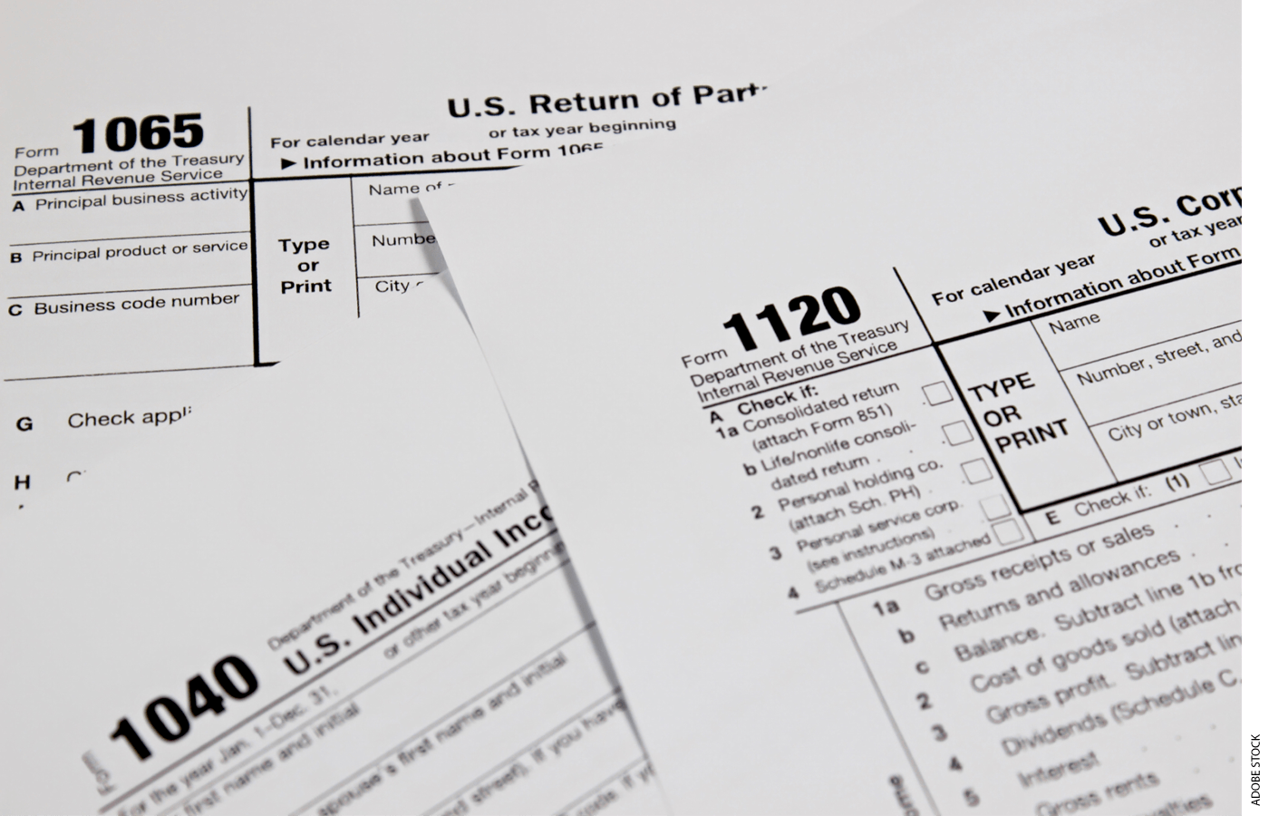 Tax forms piled on top of each other.