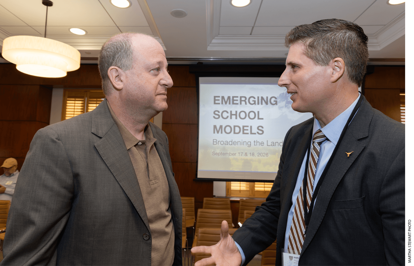 Colorado Governor Jared Polis speaks with former Oklahoma Secretary of Education Daniel Hamlin at a conference