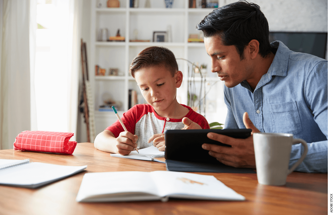 A tutor works with a student