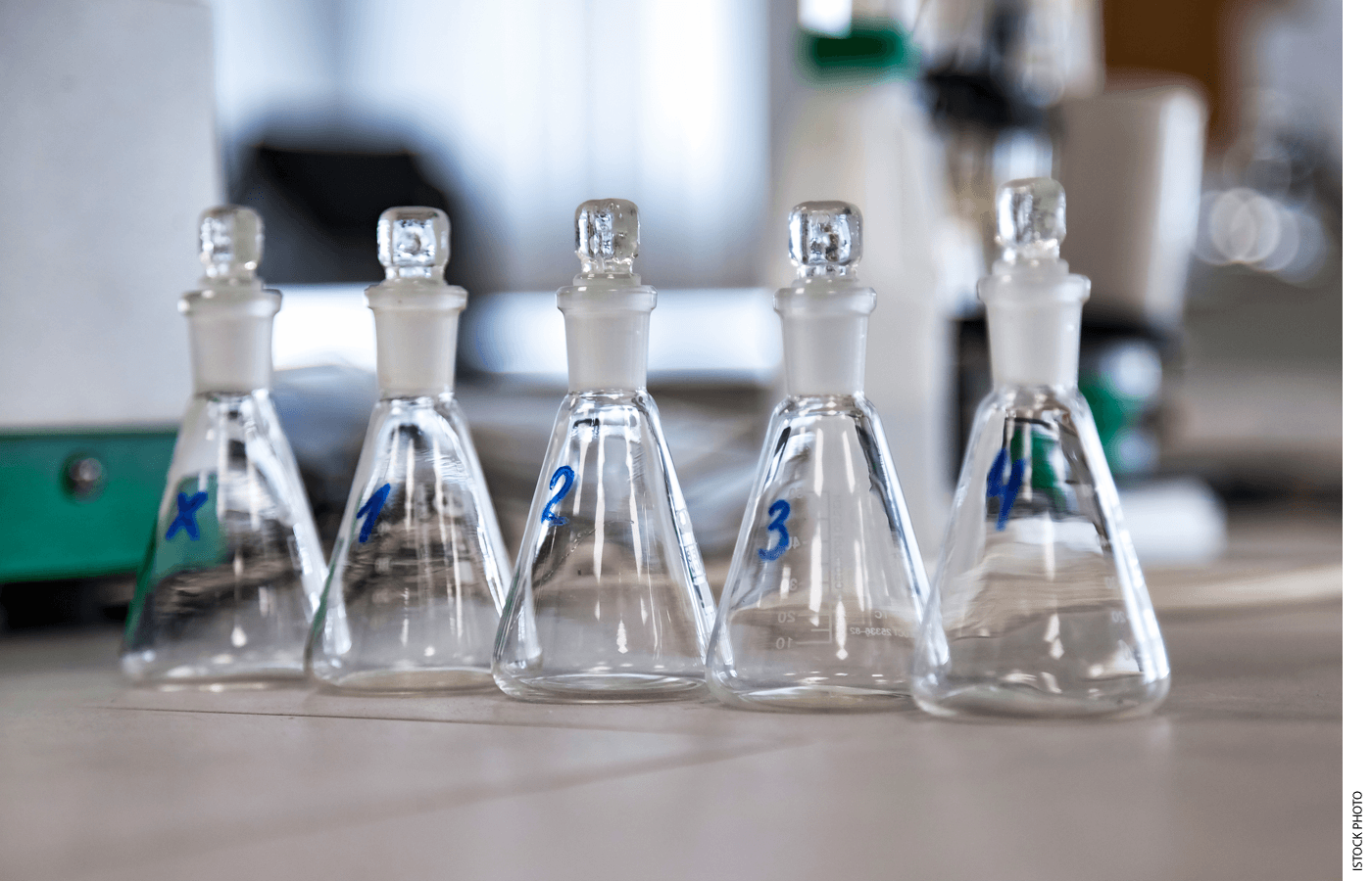 Beakers sit on a science lab table